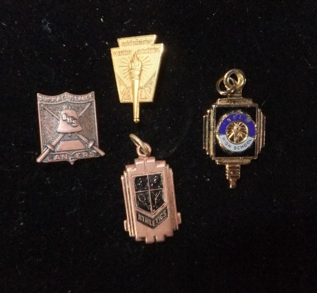 Pins and Charms contributed by Carolyn Brown:  clockwise:  National Honor Society, Bell HS Charm, Girls Athletic Award, Lancers.