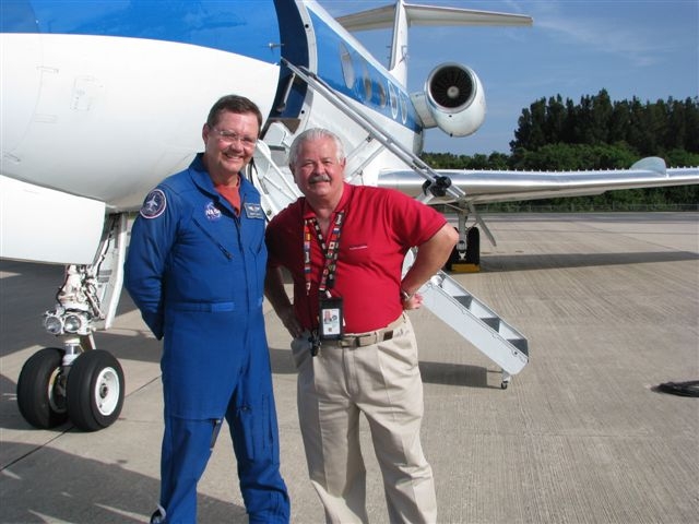 Bruce Arnold (left) and Mike Shub are standing by one of our Shuttle Training Aircraft;  its an airborne simulator that simulates the shuttles flying qualities.  Bruce has been down at KSC flying shuttle approaches with the astronaut crews who will be fly